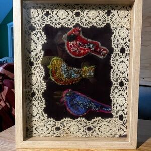 Hand-crafted bead embroidered art.